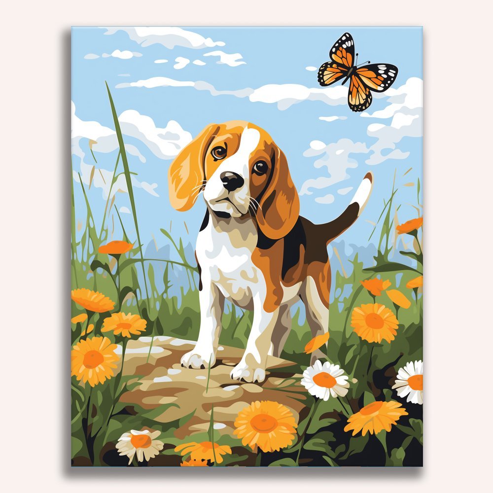 A beagle puppy stands on a stone in a grassy field, surrounded by orange flowers, looking attentively to its right as if expecting a fly to land nearby..