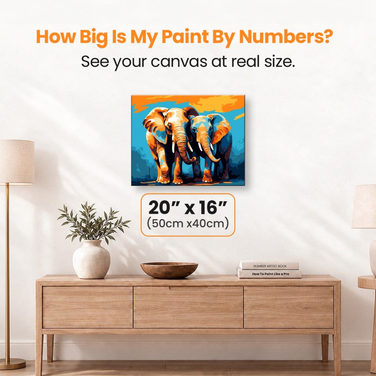 This image features a pair of elephants standing side by side against a vibrant background that transitions from orange at the top to blue at the bottom.