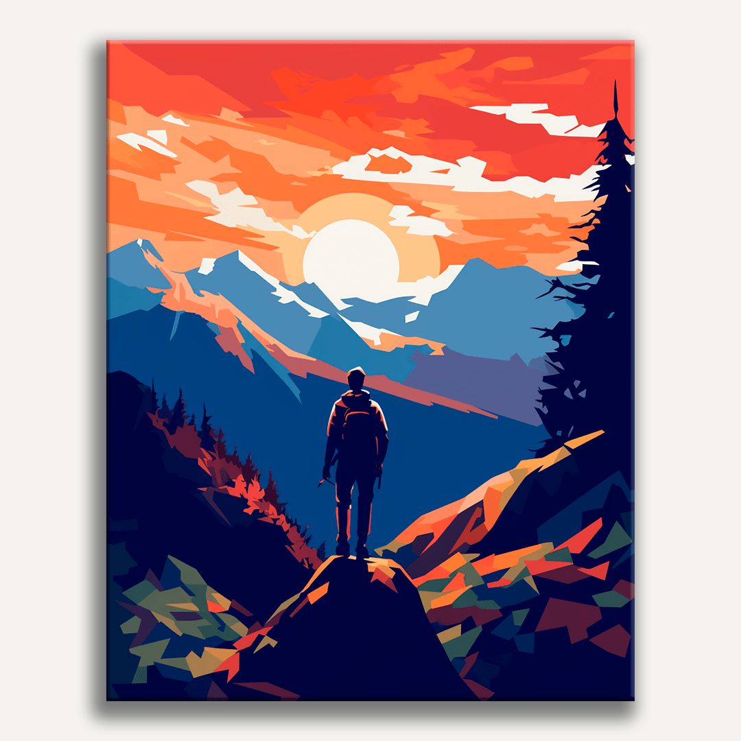 The image depicts a person standing on a rocky outcrop, looking towards a vibrant sunset or sunrise over a mountain range.