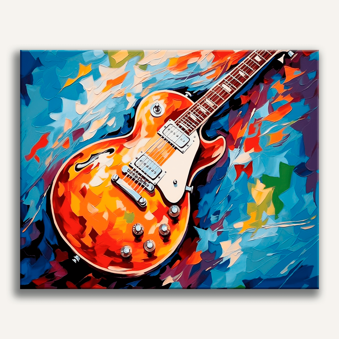 This image features a vibrant and colorful guitar lying flat against a background that appears to be abstract art.