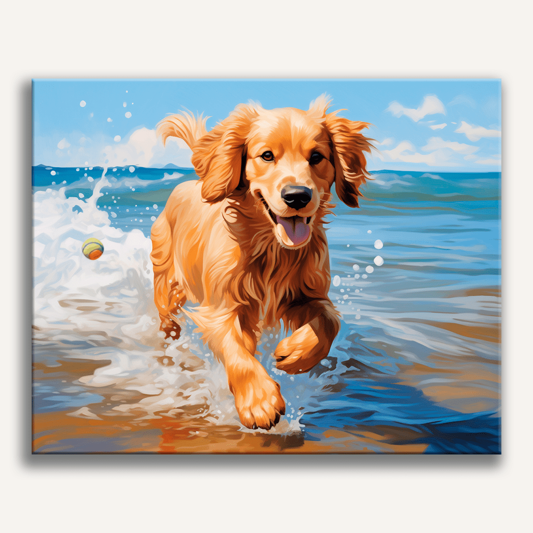 A golden retriever puppy, filled with energy and joy, runs through a sandy beach towards the camera, creating a splash of water behind it.