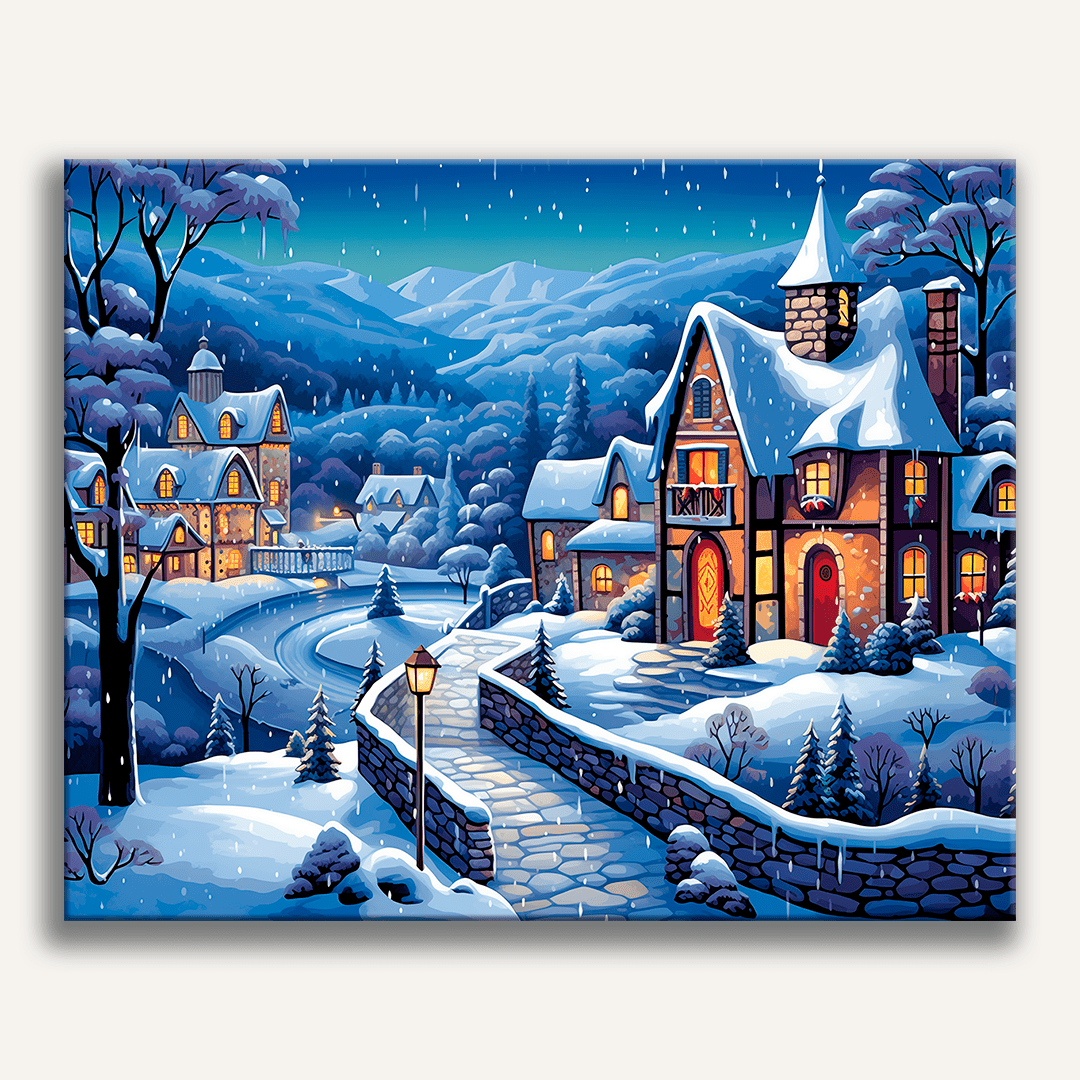 A snowy village scene at night features a traditional Christmas village with lit windows, houses, and trees.