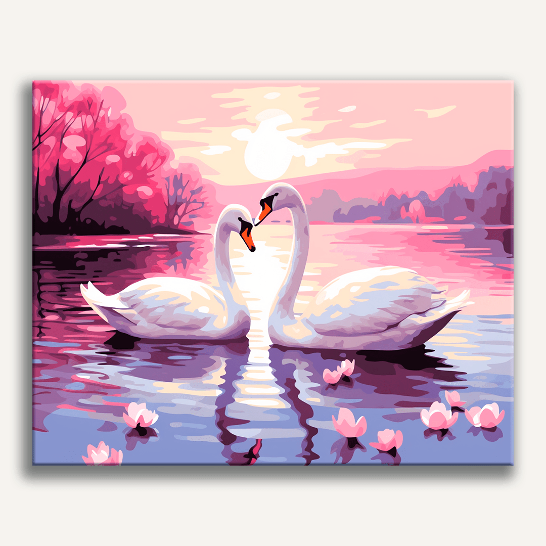 The image features two white swans floating on a serene lake at sunset.
