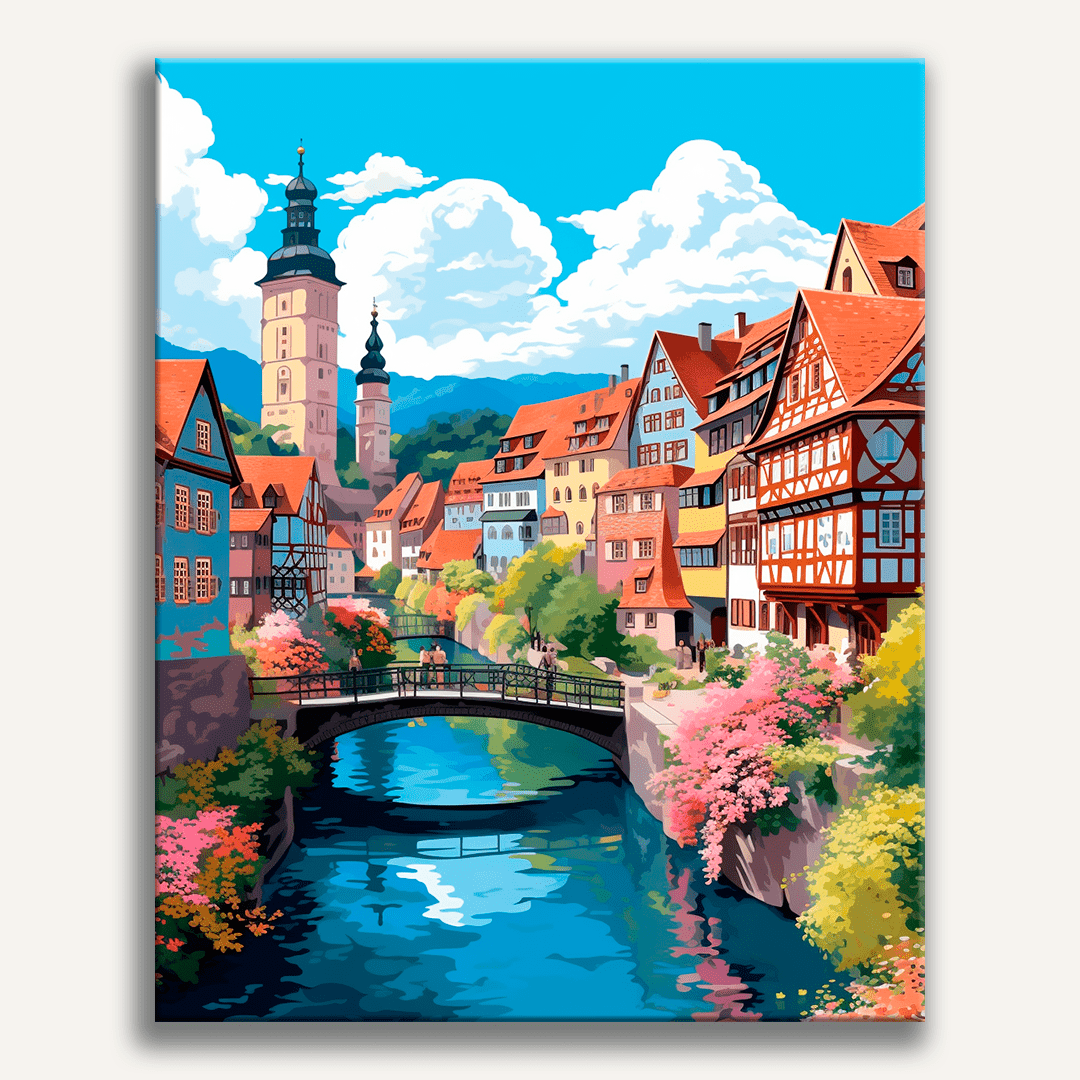 The image showcases a picturesque European town, nestled amidst lush greenery.
