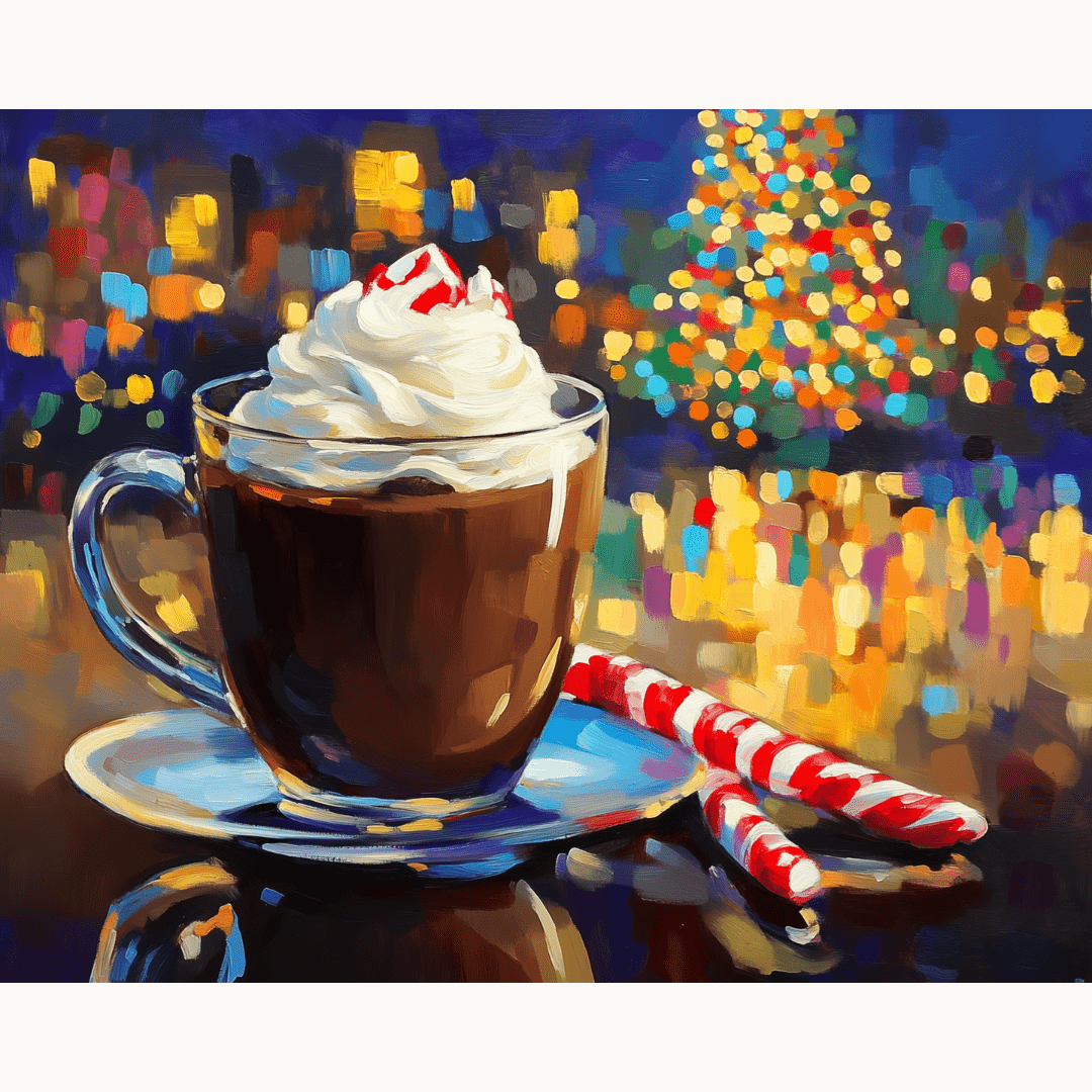 A coffee cup filled with frothy beverage sits on a table against the backdrop of a Christmas tree and lights.